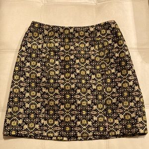 Skirt, metallic thread pattern.